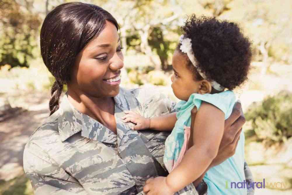 military-mom-with-child- breastfeeding while traveling
