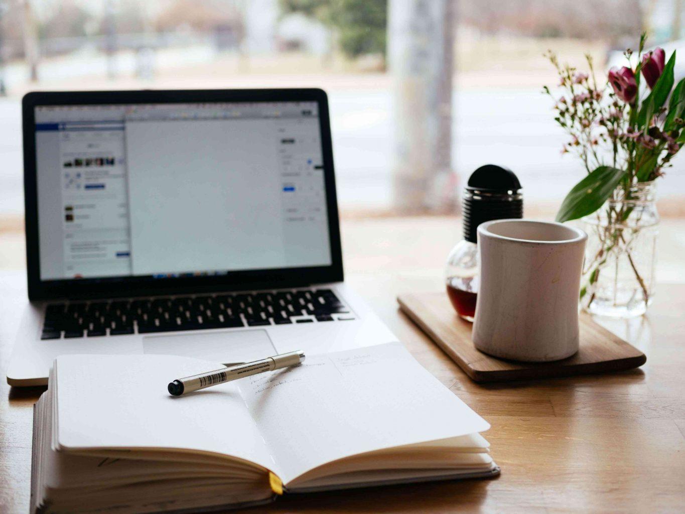 blogging-on-laptop-with-coffee-teachworkoutlove.com