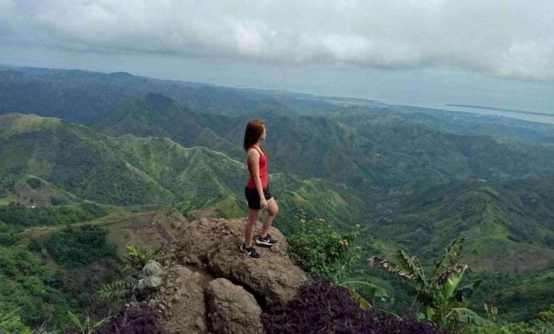 mom-reaching-her-fitness-goals-quicker-on-top-of-mountain