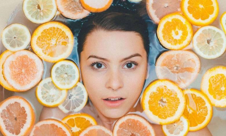 woman-skin-tightening-with-lemons-and-oranges