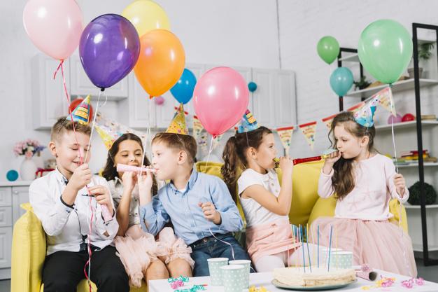 kids at a birthday party with balloons