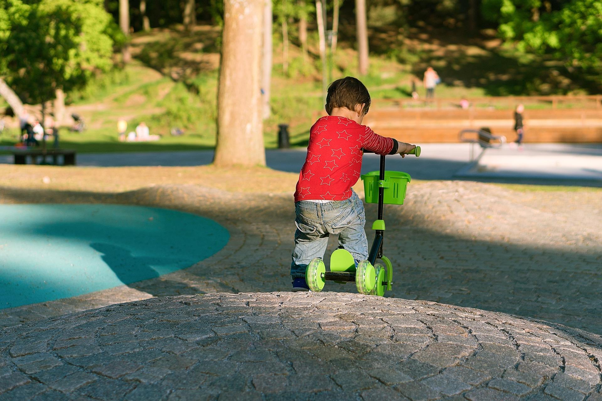 boy-riding-a-scooter