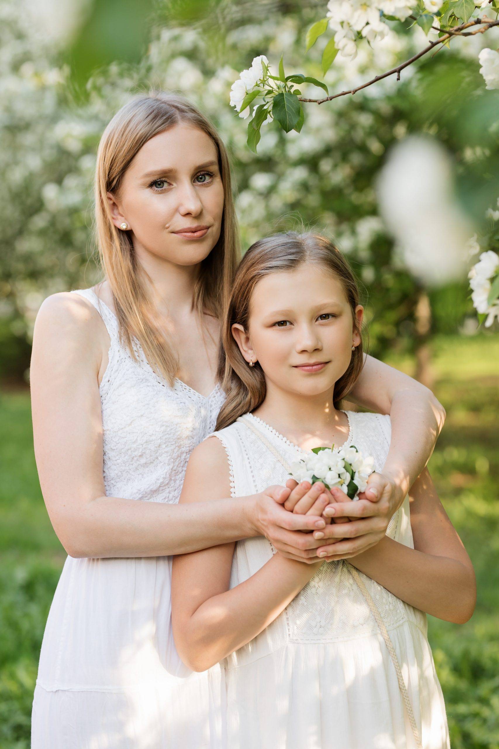 girl and her mom at her first communion with white dress code