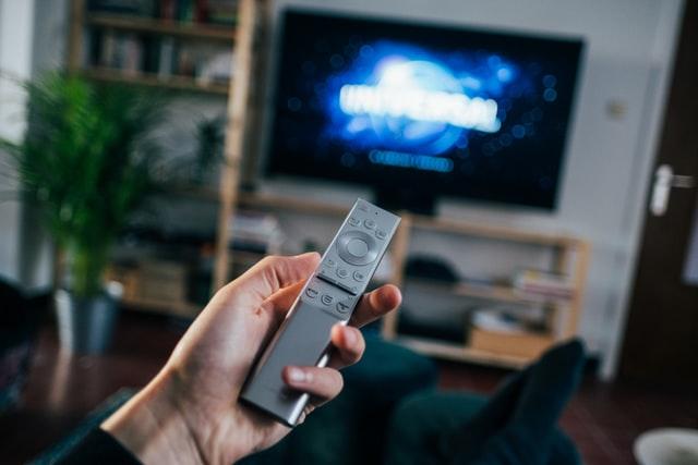 Father's Day, hand holding a remote with a TV in the background