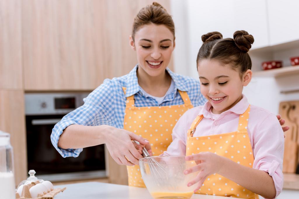 Mom cooking with her daughter - TWL