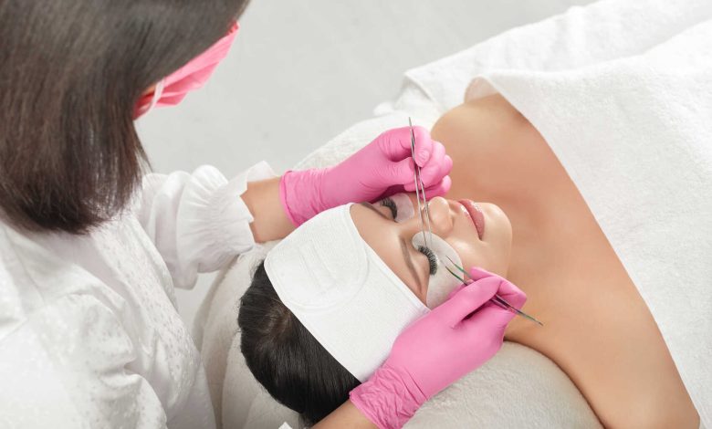 top right side view of a woman getting eyelash extensions