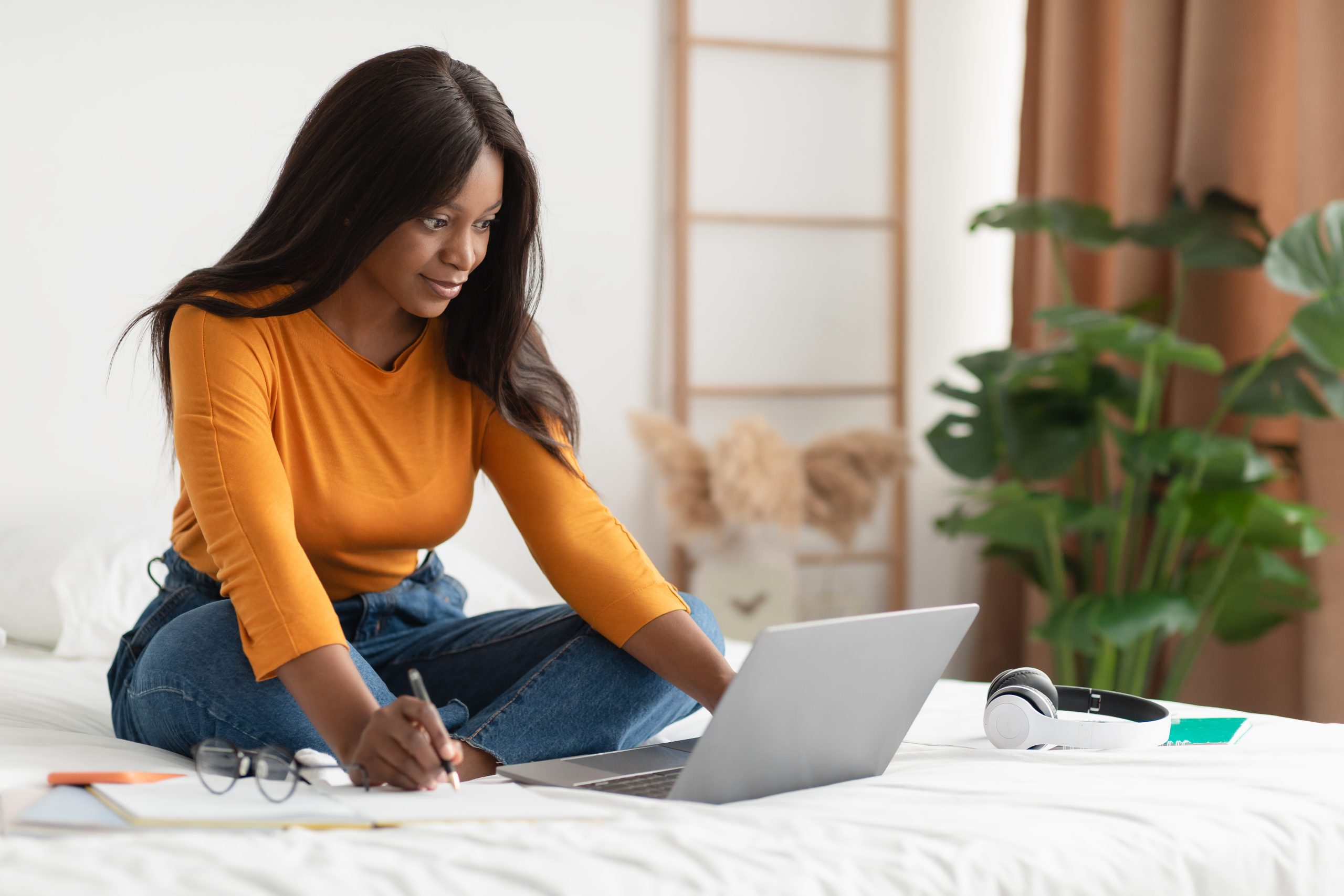 A woman trying to lean new skills on her laptop - expand your skill for Getting Through Unemployment