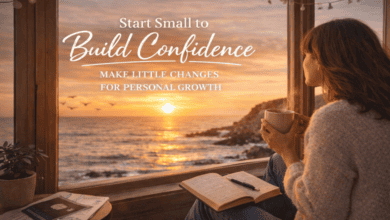 Woman sitting by a window with a journal and coffee, watching the sunset over the ocean and reflecting on building confidence and personal growth.